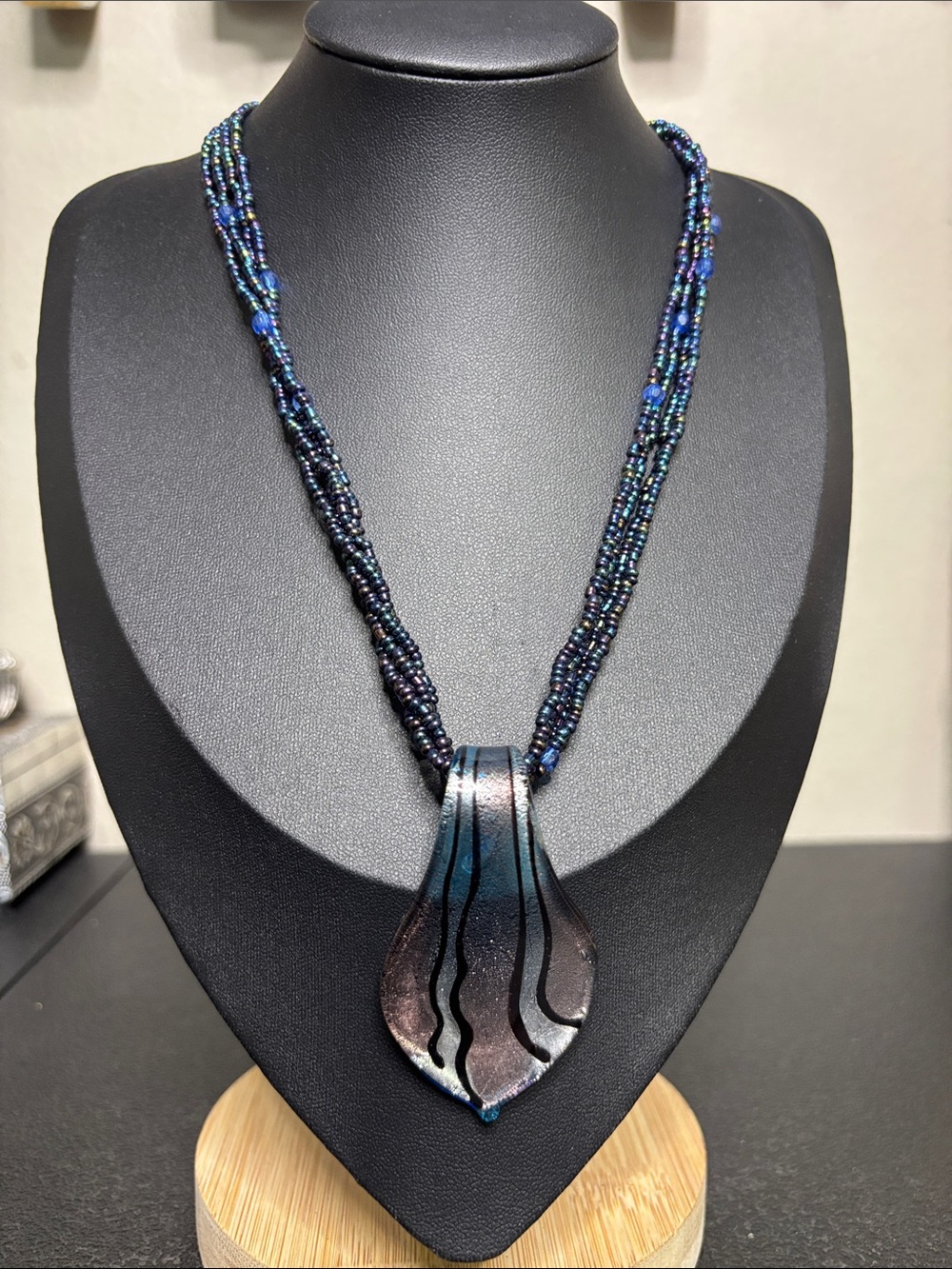 Handcrafted Blue Multi-Strand Beaded Necklace with Iridescent Pendant